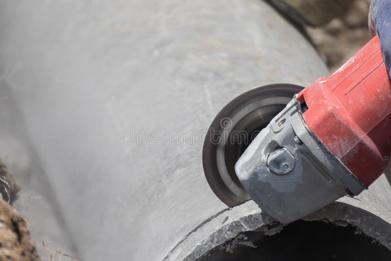 Plumbers cutting concrete water pipes royalty free stock images Plumbers cutting concrete water pipes royalty free stock images
