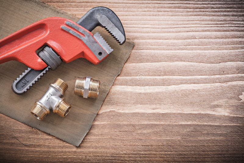 Plumbers wrench pipe fittings water mesh filter royalty free stock photos