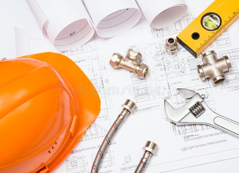 Plumbing and drawings, construction still life stock photo