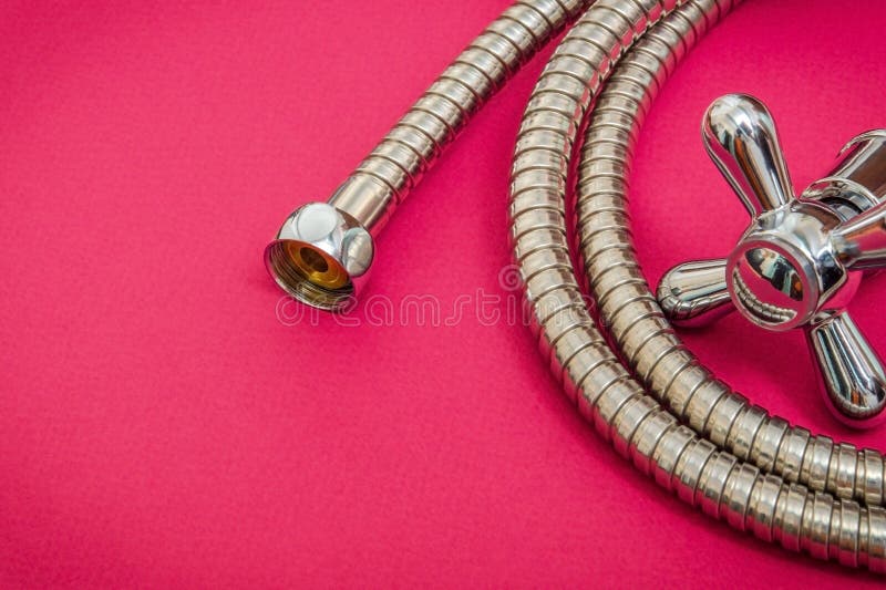 Plumbing Materials Faucet And Hose On Purple Background Are Used