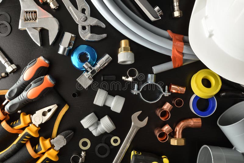 Sample of Plumbing Materials and Tools on Workbench Isolated Background