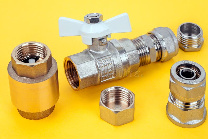 Plumbing parts on a white stock image. Image of chrome 15396949