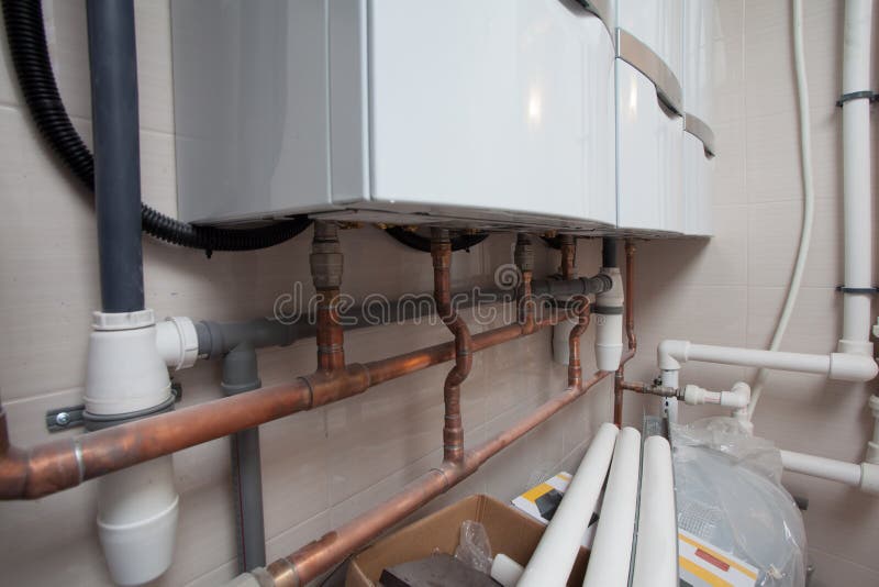 Plumbing Pipes of Heating System are Installed in Apartment Stock Photo