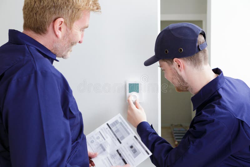 Plumbing Technical Apprentice Adjusting Central Heating Temperature