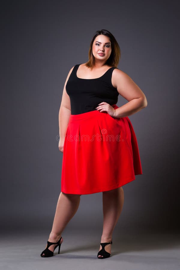 Plus Size Models. Full-figured Women Full-Length Portrait. Brunette And  Blonde In Black Bodysuits Posing On Beige Background. Body Positive  Concept. Stock Photo