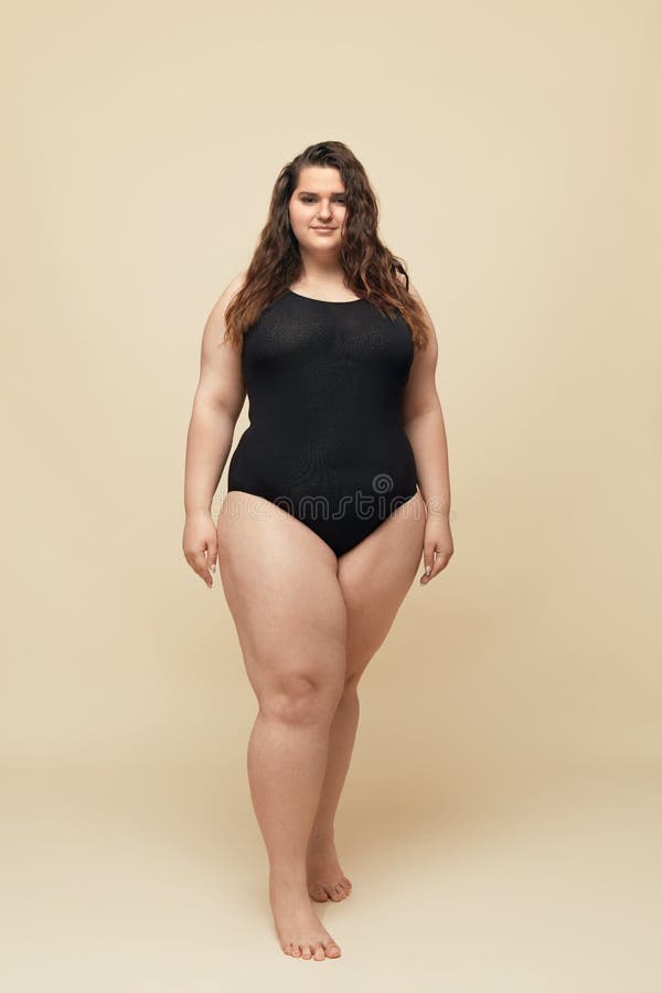 Plus Size Model. Fat Woman in Black Bodysuit Full-length Portrait