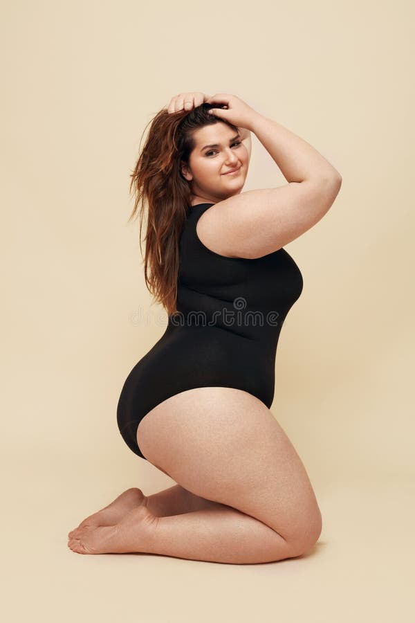 Monograph guld Kære Plus Size Model. Fat Woman in Black Bodysuit Portrait. Brunette Touching  Hair and Posing on Beige Background. Stock Image - Image of lifestyle,  happy: 183623147