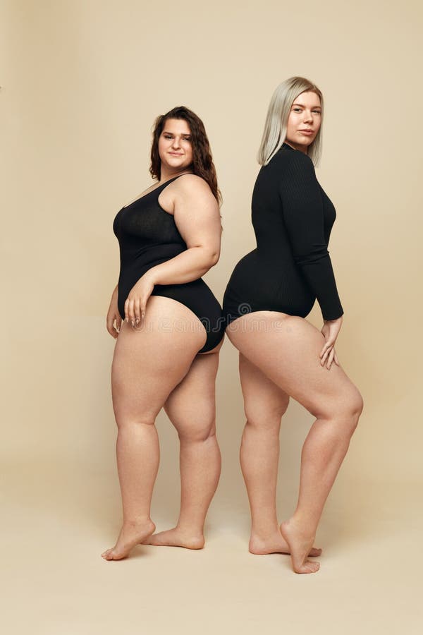 Plus Size Models. Full-figured Women in Black Bodysuits Full-length  Portrait. Brunette and Blonde Posing on Beige Background Stock Image -  Image of concept, female: 183623255