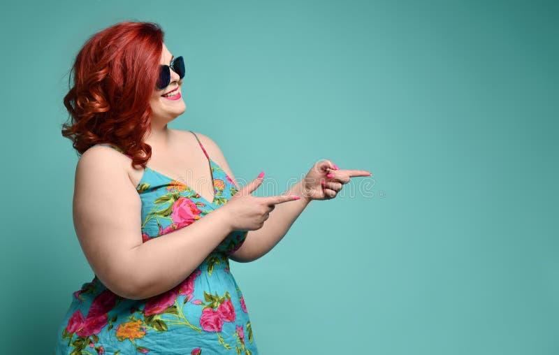 Plus-size Overweight Redhead Lady in Sunglasses Shows a Gesture Sign Finger  - Gun, Aimed at Free Text Copy Space on Mint Stock Photo - Image of model,  cool: 148244888