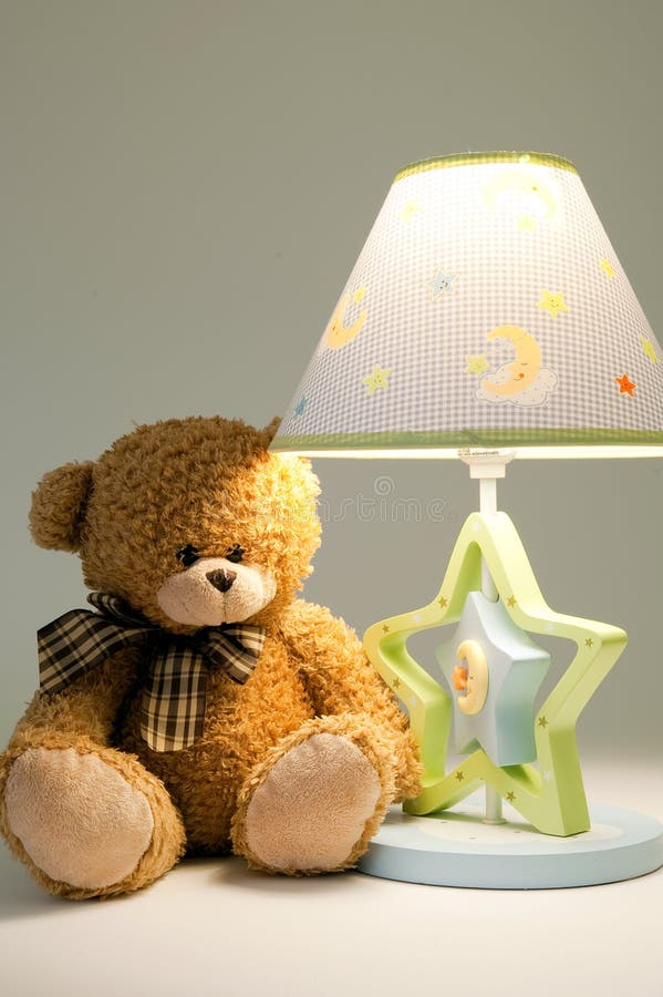 Plush bear and lamp stock photo. Image of postcard, lamp 12850912
