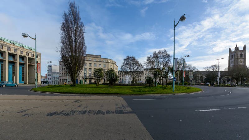 St Andrews Cross Roundabout with Royal Building in Background. Plymouth, England - April 15, 2018: St Andrews Cross Roundabout with Royal Building in Background stock photos St Andrews Cross Roundabout with Royal Building in Background. Plymouth, England - April 15, 2018: St Andrews Cross Roundabout with Royal Building in Background stock photos