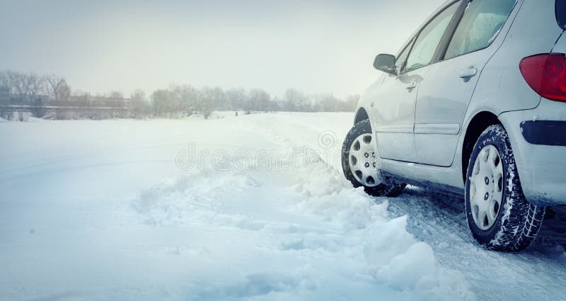 Winter tire - tyre in the snow. Dangerous driving conditions. Driving safely in the winter. Winter tire - tyre in the snow. Dangerous driving conditions. Driving safely in the winter