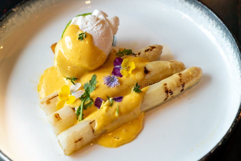 Poached egg grilled white asparagus