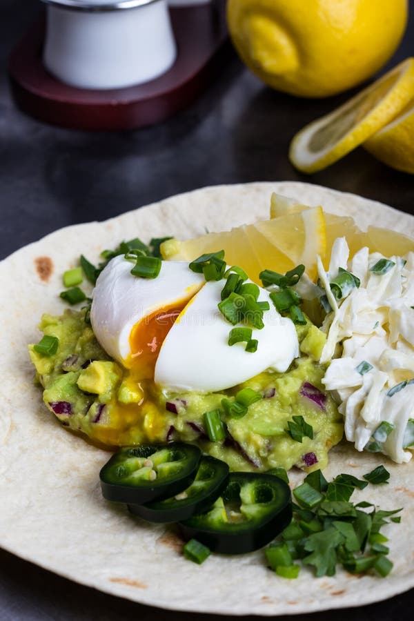 Poached Egg and Guacamole Sauce on Flour Tortilla Stock Photo - Image ...