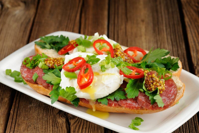 Poached Egg Sandwiches with Chili, Scallion and Salami Stock Photo