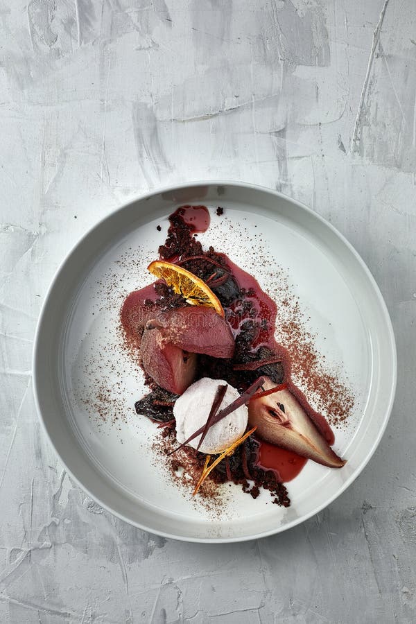 Poached pear with an ice cream in red wine sauce