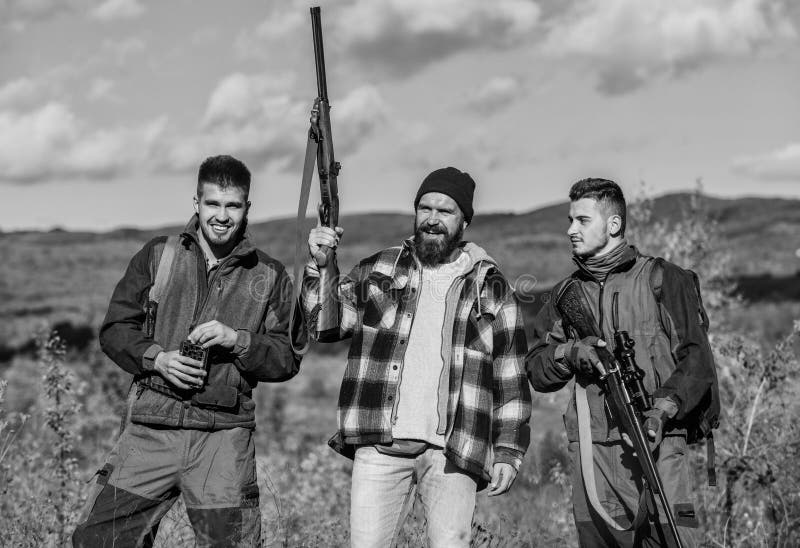 Poacher partner in crime. Activity for real men concept. Hunters gamekeepers looking for animal or bird. Hunters with stock photo Poacher partner in crime. Activity for real men concept. Hunters gamekeepers looking for animal or bird. Hunters with stock photo