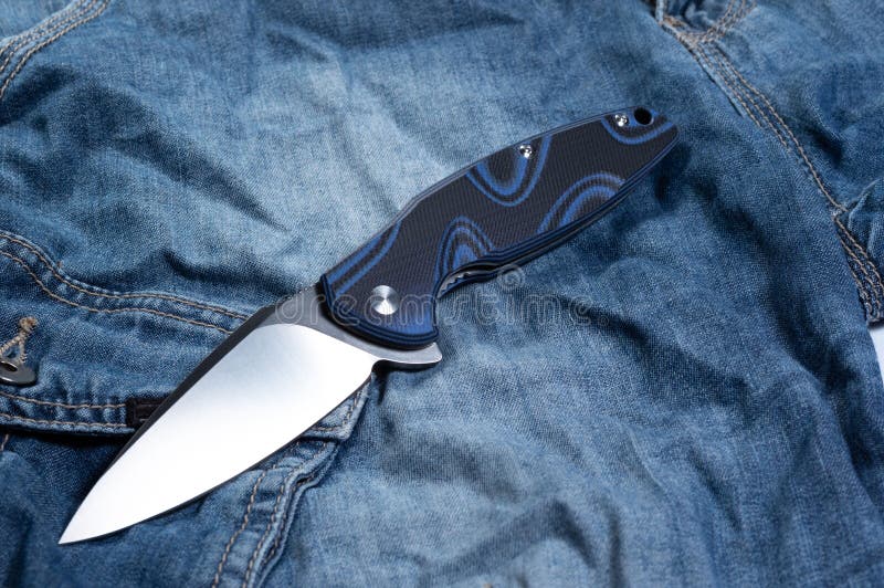 Pocket Knife with a Blue Handle. Knife and Jeans Stock Photo Image of