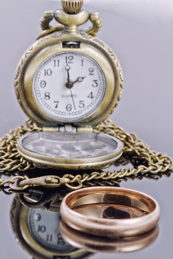 Pocket Watch And A Gold Wedding Ring Stock Photo Image of gift, business 46369816