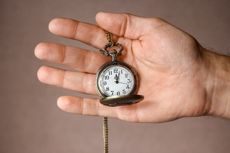 A Pocket Watch in the Hands of a Man Stock Photo Image of concept