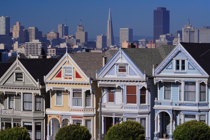 Alamo Squares Painted Ladies with San Franciscos city skyline. Alamo Squares Painted Ladies with San Franciscos city skyline