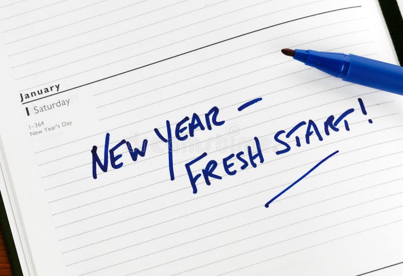 A calendar with the words New Year - Fresh Start written on January 1. A calendar with the words New Year - Fresh Start written on January 1.