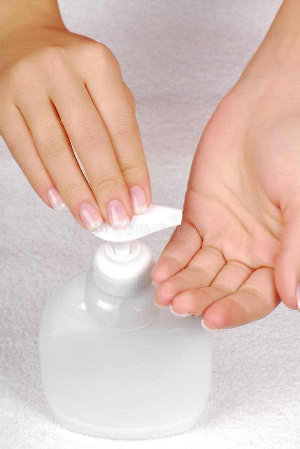 Hygiene - Woman press the liquid soap on hands. Hygiene - Woman press the liquid soap on hands.