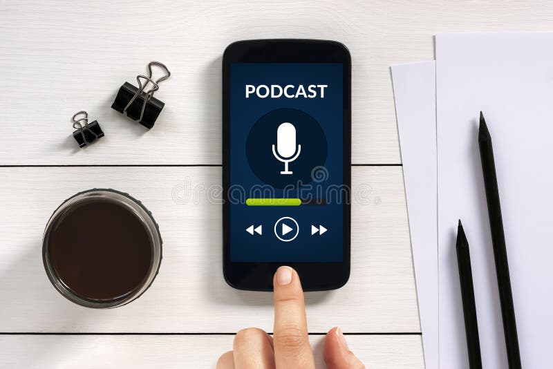 Podcast concept on smart phone screen with office objects royalty free stock photography