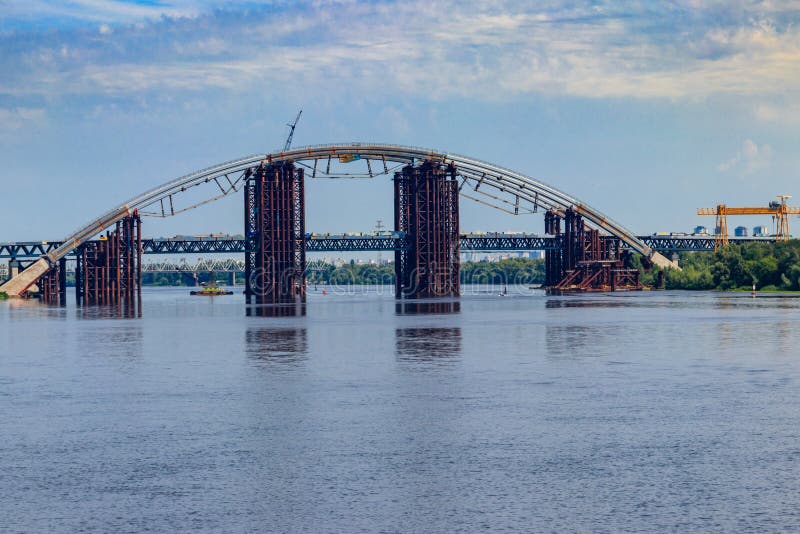 Podilsko-Voskresenskyi Bridge or Podilskyi Metro Bridge is a combined road-rail bridge over the Dnieper River under construction stock photo Podilsko-Voskresenskyi Bridge or Podilskyi Metro Bridge is a combined road-rail bridge over the Dnieper River under construction stock photo