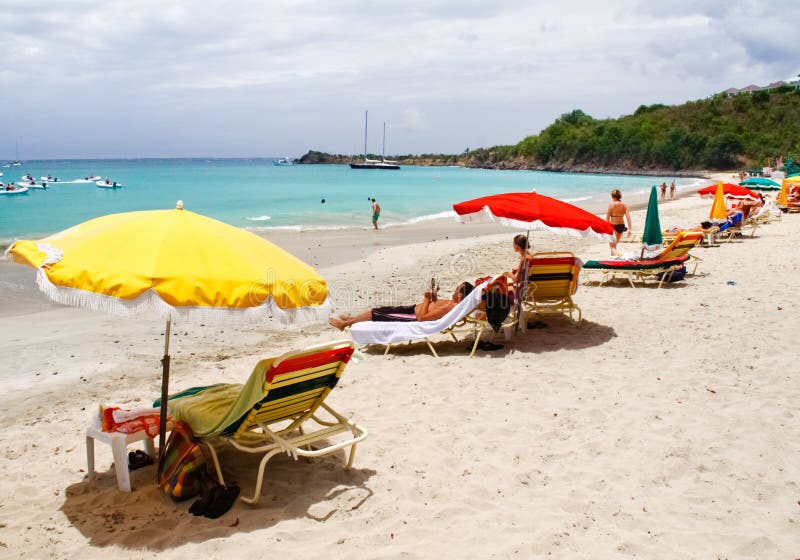 The Caribbean Sea, beach chairs, umbrellas and lots of sand and sun await at secluded Friars Bay beach in amazing St. Martin. The Caribbean Sea, beach chairs, umbrellas and lots of sand and sun await at secluded Friars Bay beach in amazing St. Martin.