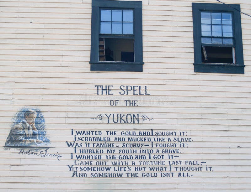 Dawson City, CAnada - August 4, 2008; Poetry of Robert Service on wall of Dawson City building TheSpell of the Yukon,