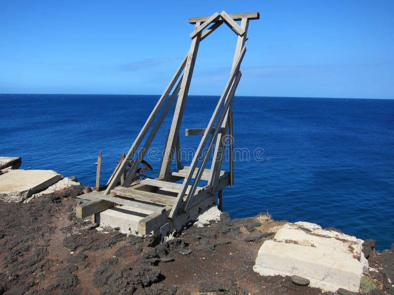 The Southern most point of America on the Hawaiian Island of Hawaii, South point early shipping dock on the lava rock cliffs. The Southern most point of America on the Hawaiian Island of Hawaii, South point early shipping dock on the lava rock cliffs.