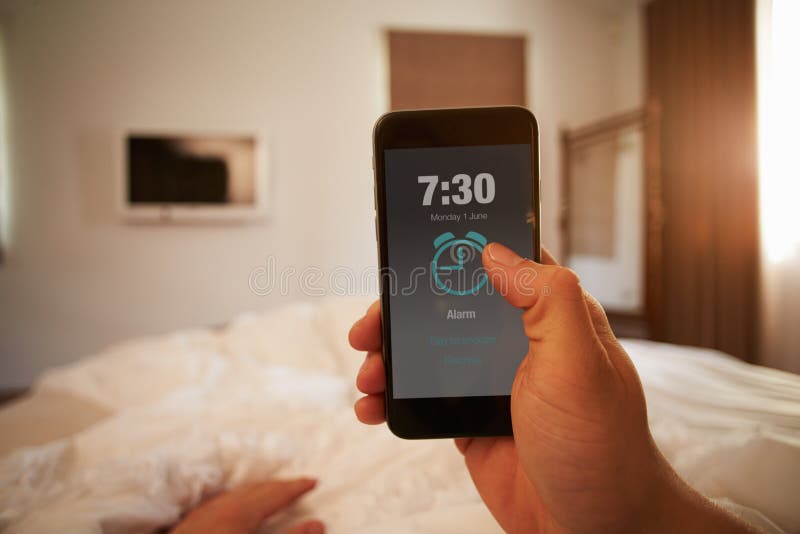 Point Of View Image Of Person In Bed Turning Off Phone Alarm royalty free stock image Point Of View Image Of Person In Bed Turning Off Phone Alarm royalty free stock image