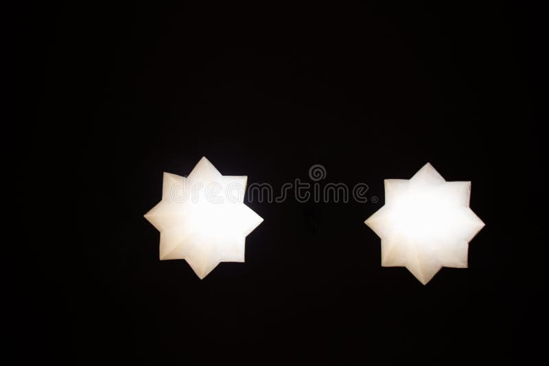 8 pointed star holes through a wall on display royalty free stock photo