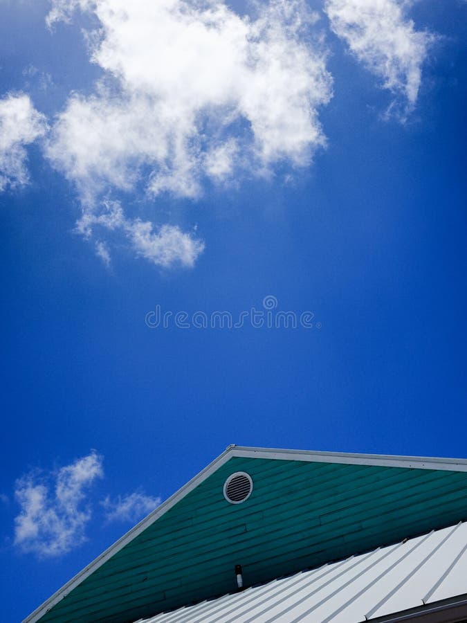 A Turquoise Roof Under a Blue Sky