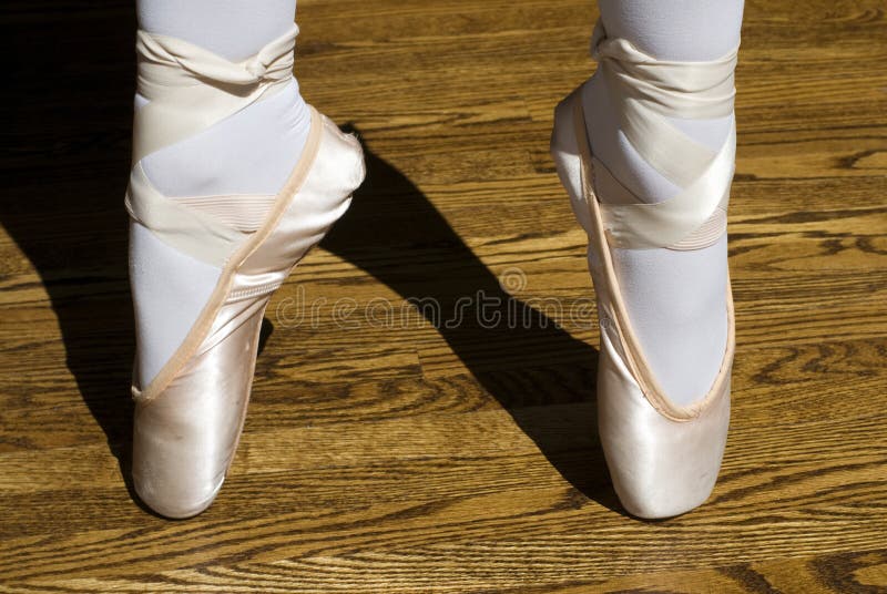 Ballet pointe shoes shot on a sunny day. Ballet pointe shoes shot on a sunny day.
