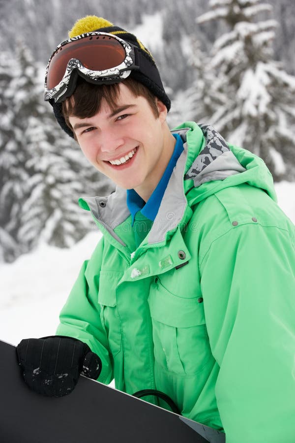 pojkeferie skidar den tonårs- snowboarden royaltyfria bilder pojkeferie skidar den tonårs- snowboarden royaltyfria bilder