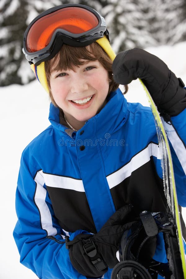 pojkeferie skidar snowboardbarn royaltyfria foton pojkeferie skidar snowboardbarn royaltyfria foton
