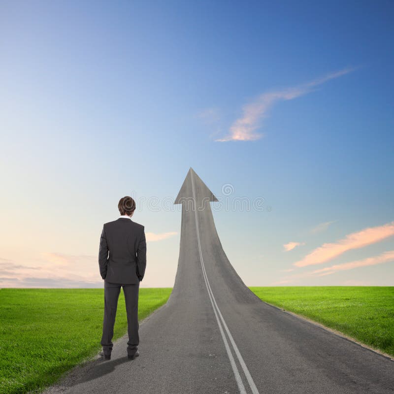 Concept of the road to success with a businessman standing on the road. Concept of the road to success with a businessman standing on the road