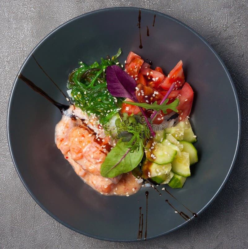 Poke with Salmon with Unagi Sauce Garnished with Herbs Stock Image