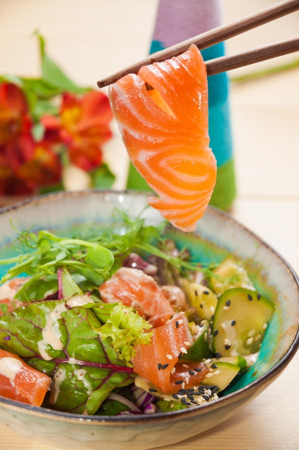 Poke with salmon and vegetables. Close up stock images