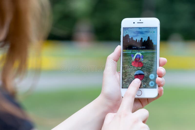 Varna, Bulgaria - Jul 20, 2016: Nintendo Pokemon Go augmented reality mobile application game with Jynx pokemon catching on Apple iPhone 6S in female hands. Varna, Bulgaria - Jul 20, 2016: Nintendo Pokemon Go augmented reality mobile application game with Jynx pokemon catching on Apple iPhone 6S in female hands.