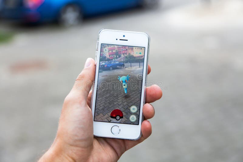 WROCLAW, POLAND - JULY 31, 2016: Popular augmented reality game Pokemon Go on the screen of Apple iPhone 5s smartphone. WROCLAW, POLAND - JULY 31, 2016: Popular augmented reality game Pokemon Go on the screen of Apple iPhone 5s smartphone
