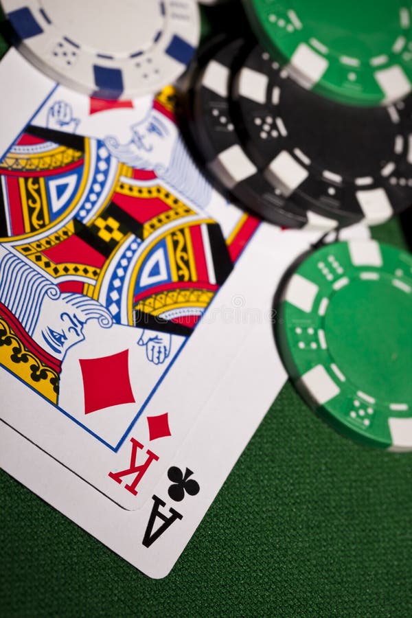 Poker cards on green background