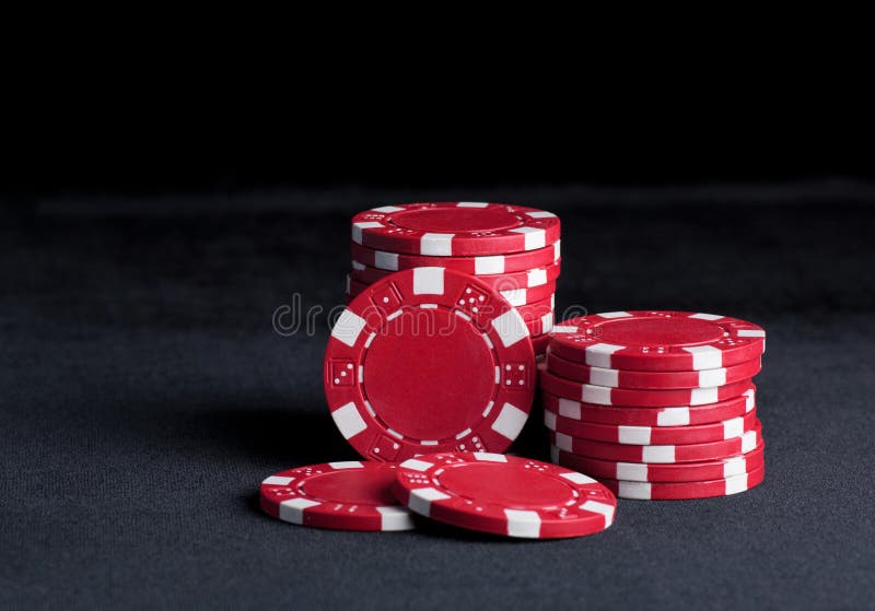 Black Poker Chips Stand In Front Of Money, Closeup Stock Photo Image