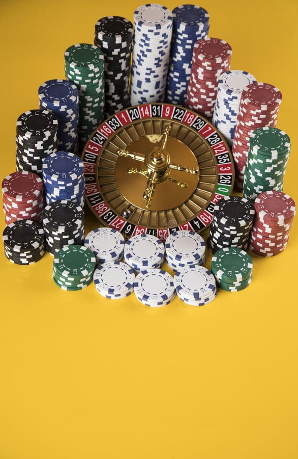 Poker Chips on Gaming Table, Roulette Wheel in Motion, Casino