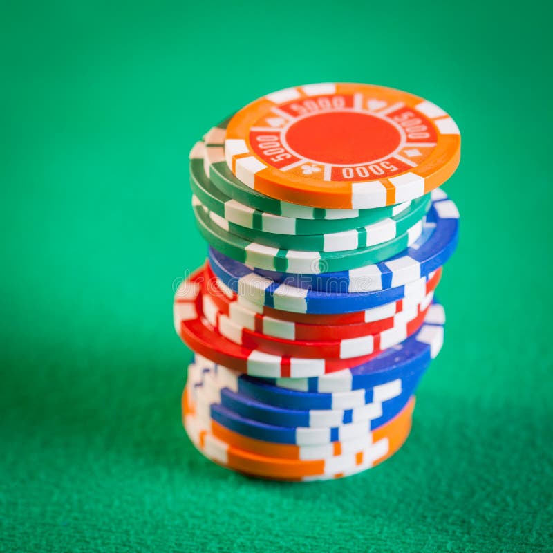 Poker Chips Stacked on Green Table Stock Photo Image of stack, orange