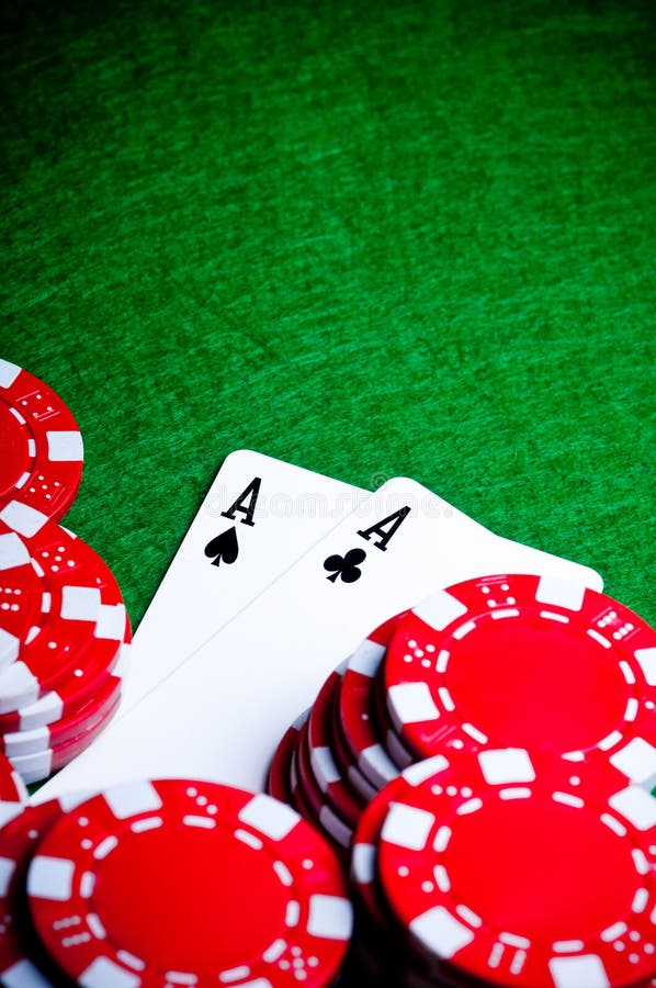 Poker hand with chips, Pocket Aces royalty free stock photo