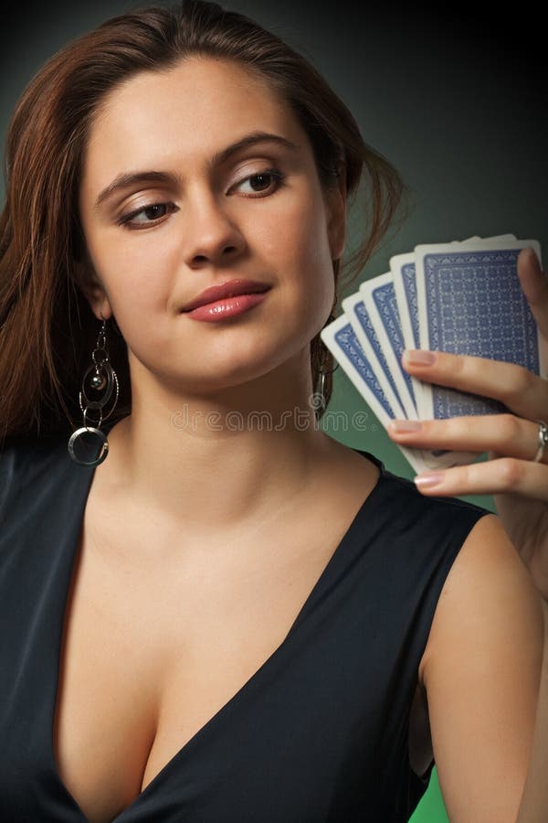 Poker player in casino with cards and chips on green background