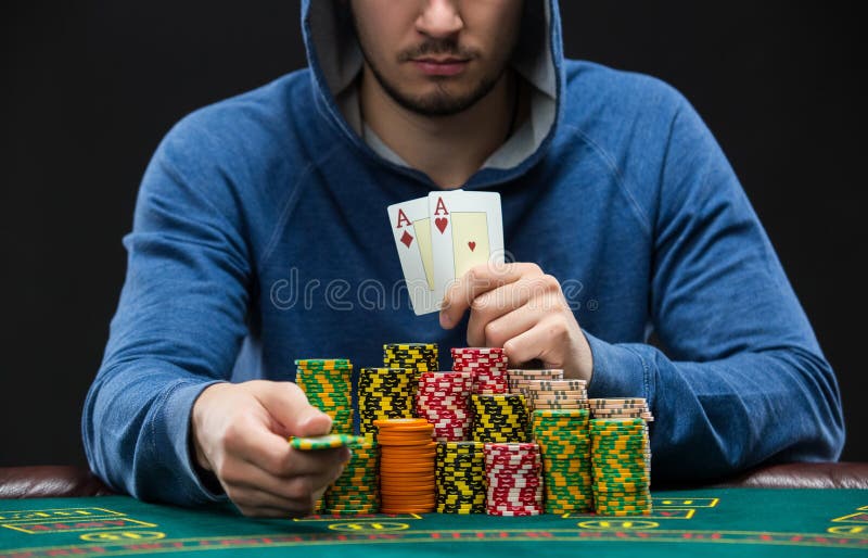 Poker Player Showing a Pair of Aces. Closeup Stock Image Image of